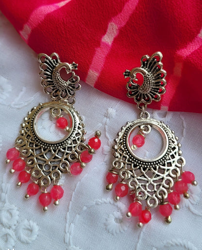 silver danglers with pink beads and studs