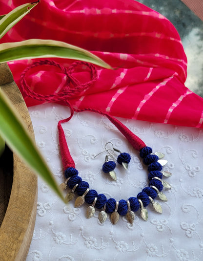 Necklace and earrings with pink and blue accents