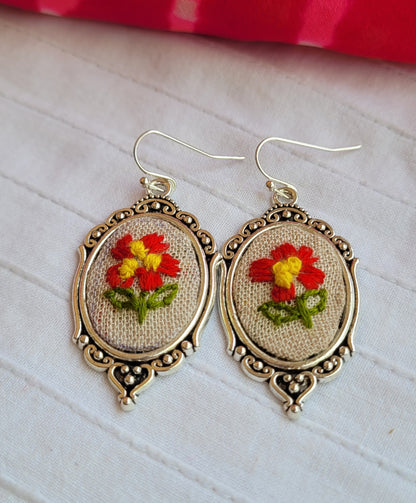 Pair of earrings with embroidered floral design
