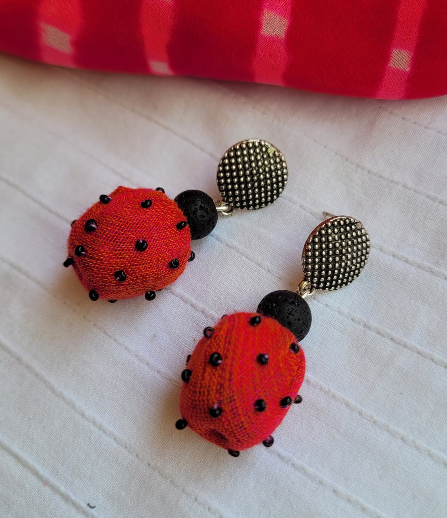 Red ladybug earrings with black spots 