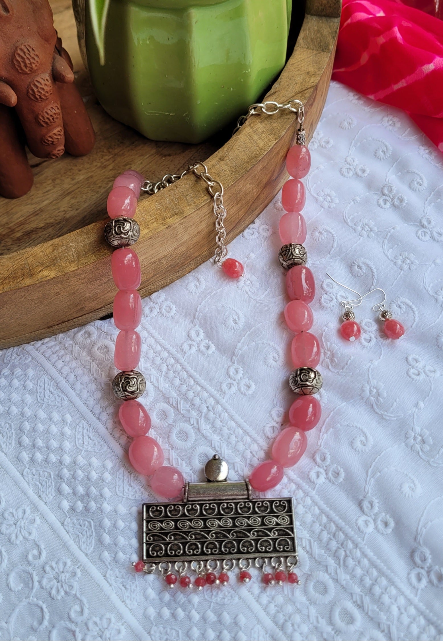 Necklace with pink beads and silver clasp 
