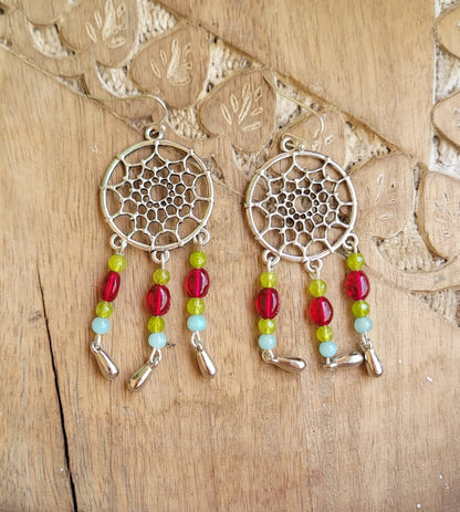 Pair of silver dreamcatcher earrings with colorful beads 