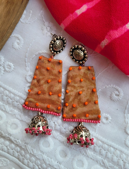 Decorative earrings with orange and pink accents 