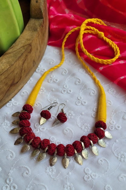 yellow and maroon thread beads set