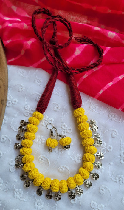 Yellow and silver necklace with matching earrings