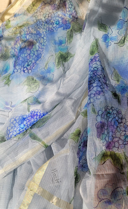 Close-up of floral-patterned fabric with blue and green colors.