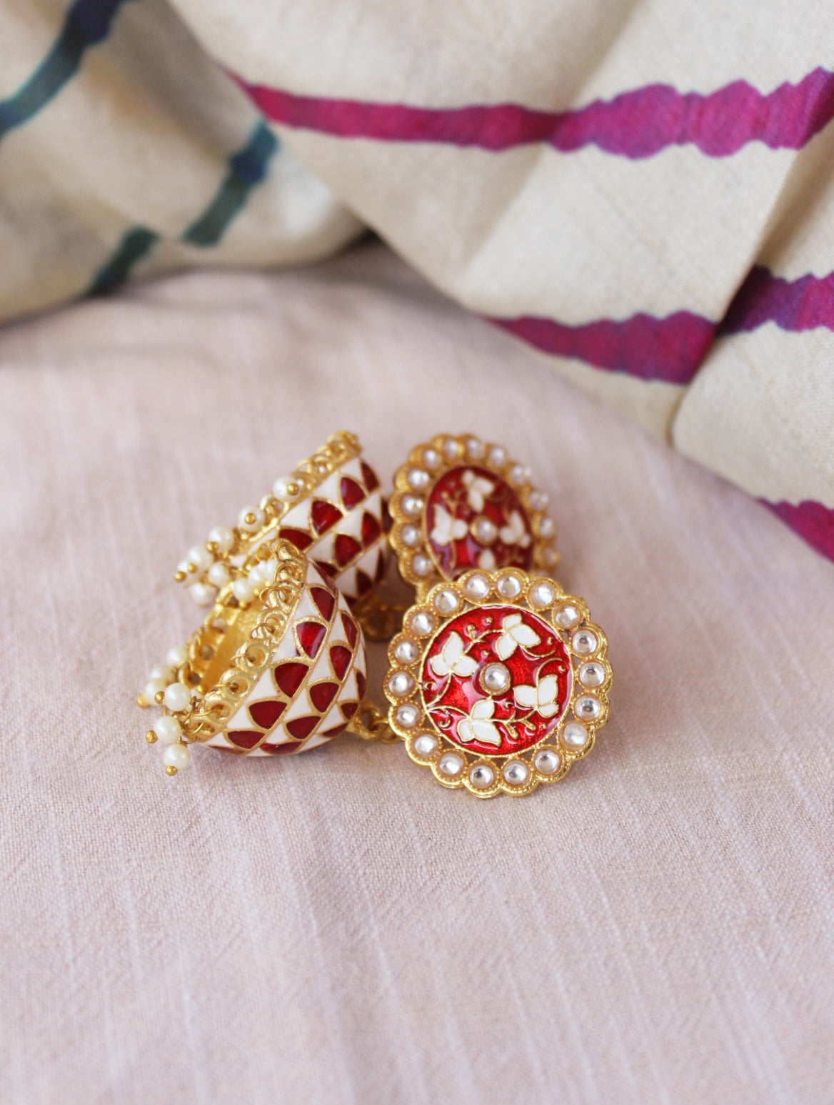 red jhumka earrings